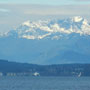 a view of the olympic mountains from alki beach